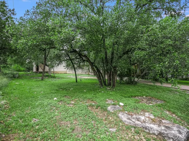 a view of grassy field with benches