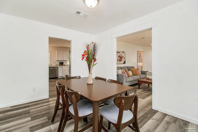 a view of a dining room with furniture