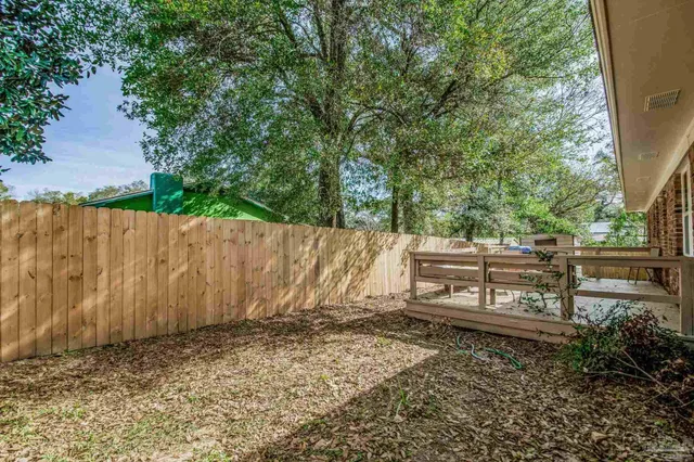 a view of a backyard with trees
