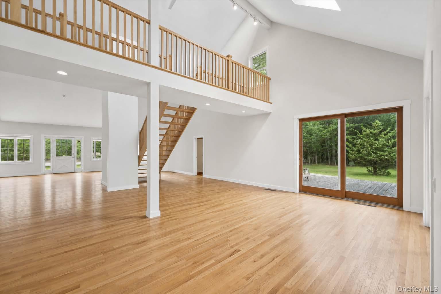 131 Red Creek Road Hampton Bays, NY 11946 - Photo 30 of 35 a view of an entryway with wooden floor