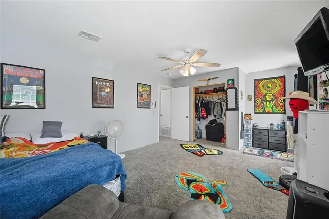 a bedroom with furniture and a chandelier