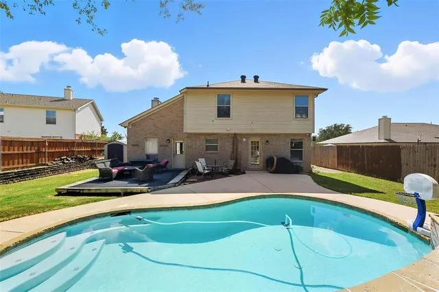 a view of a house with a swimming pool