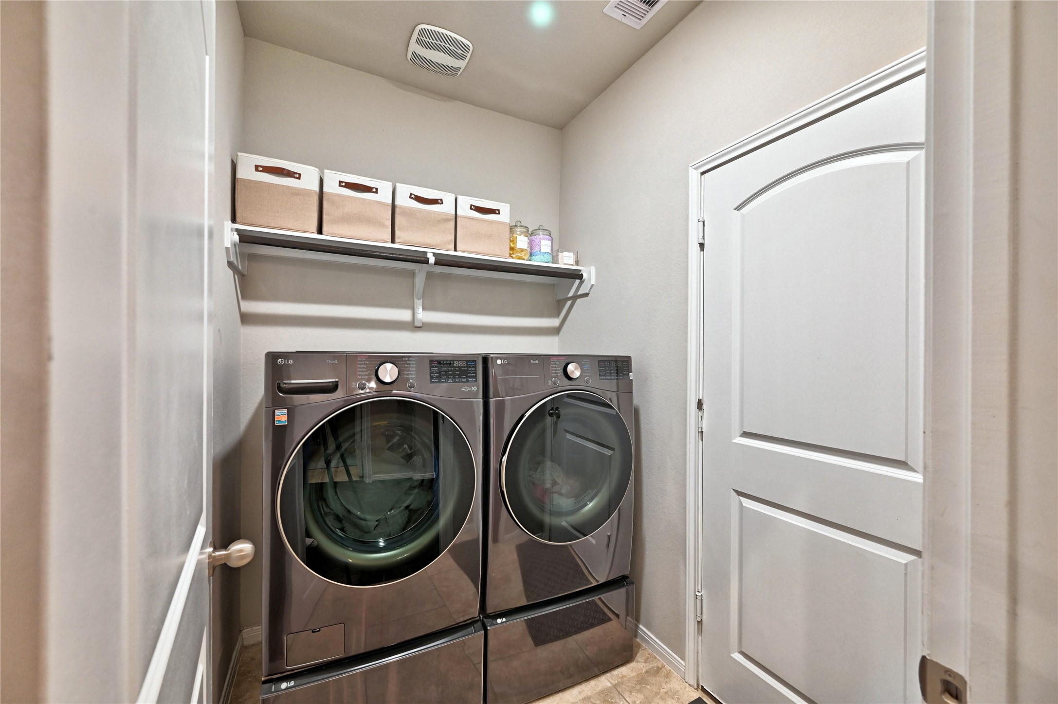 23118 Southern Brk Trail Spring, TX 77389 - Photo 13 of 50 This is a photo of the utility room with its shelving and hanging rod.