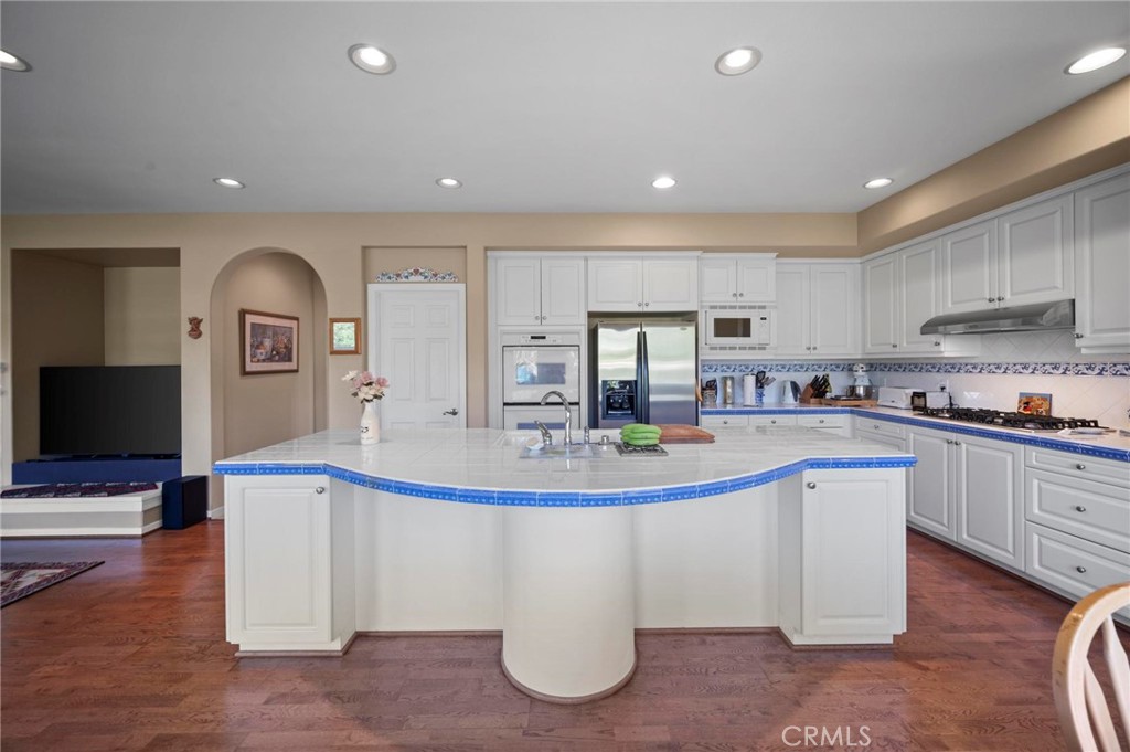 3262 Bluebird Circle Simi Valley, CA 93063 - Photo 13 of 43 a view of kitchen with stainless steel appliances granite countertop a sink and cabinets