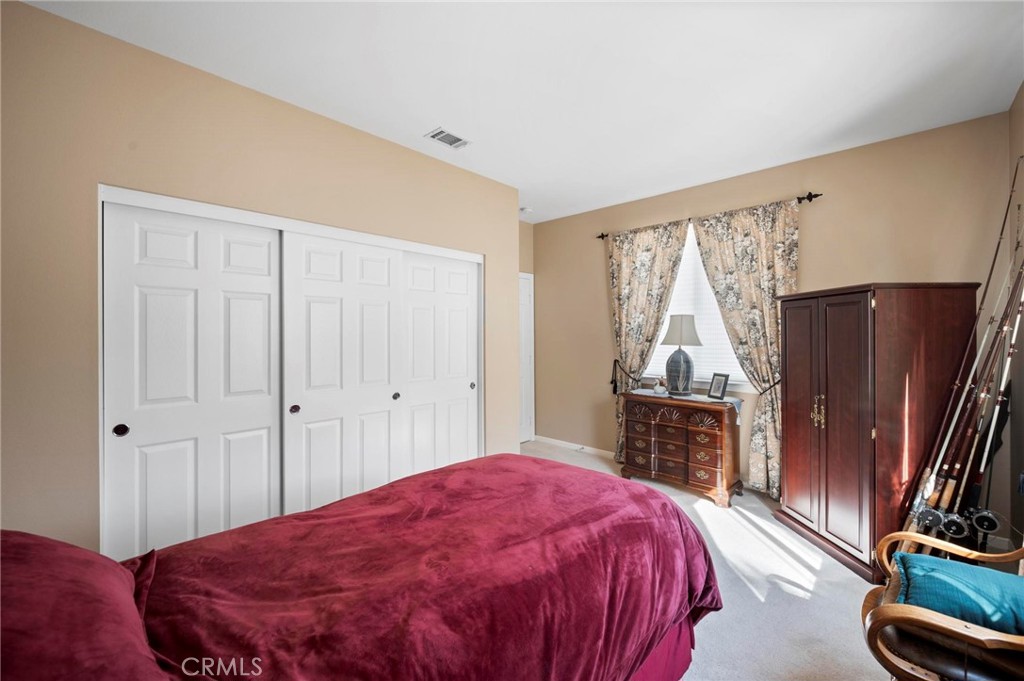 3262 Bluebird Circle Simi Valley, CA 93063 - Photo 20 of 43 a bedroom with a bed and a flat tv screen