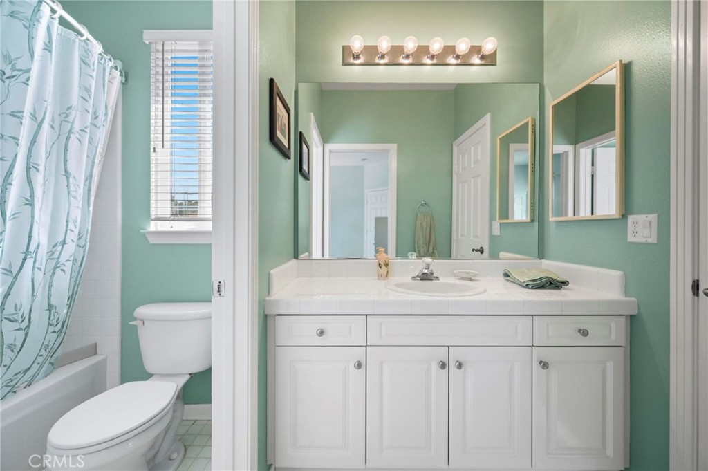 3262 Bluebird Circle Simi Valley, CA 93063 - Photo 23 of 43 a bathroom with a toilet sink and mirror