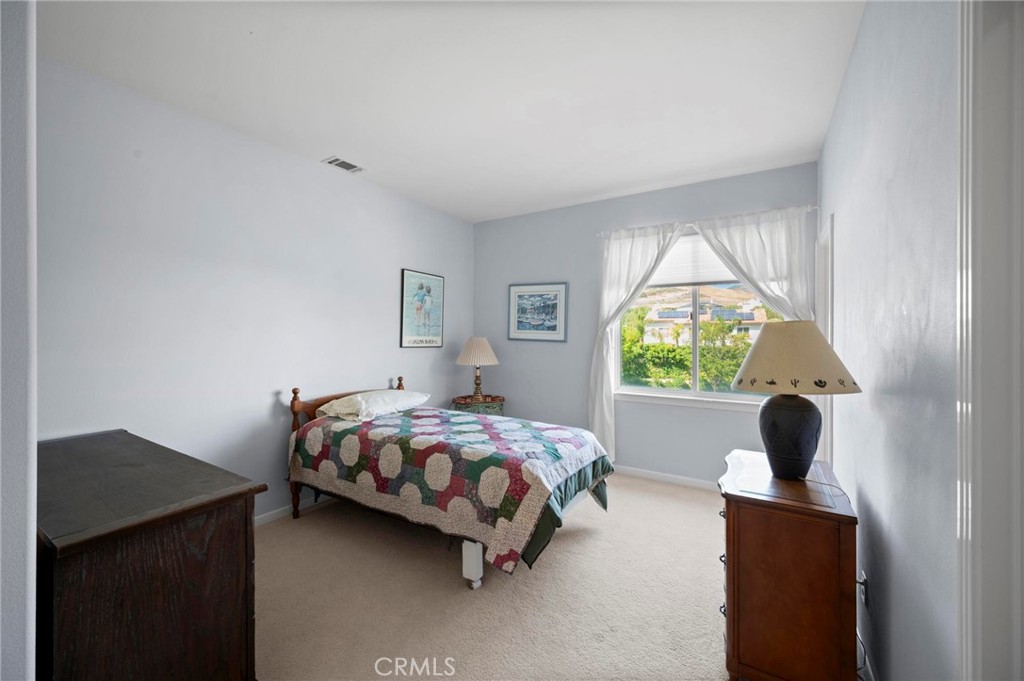 3262 Bluebird Circle Simi Valley, CA 93063 - Photo 24 of 43 a bedroom with a bed window and a window