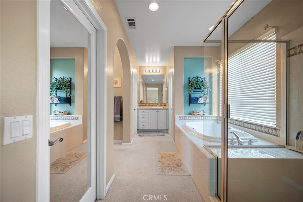 3262 Bluebird Circle Simi Valley, CA 93063 - Photo 30 of 43 a bathroom with a tub shower and mirror