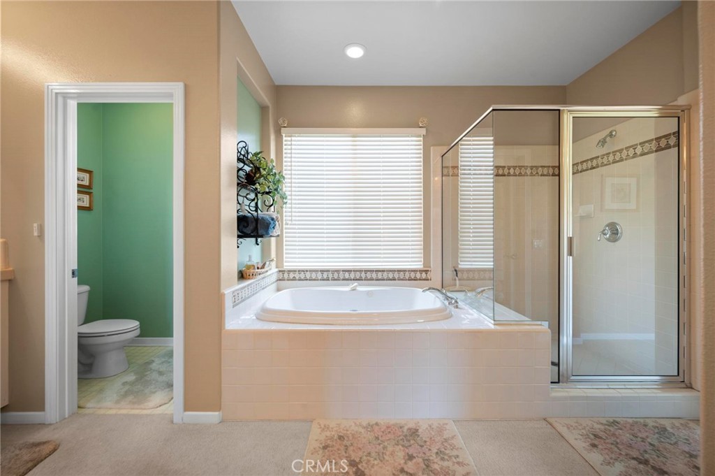 3262 Bluebird Circle Simi Valley, CA 93063 - Photo 32 of 43 a bathroom with a bathtub and a shower