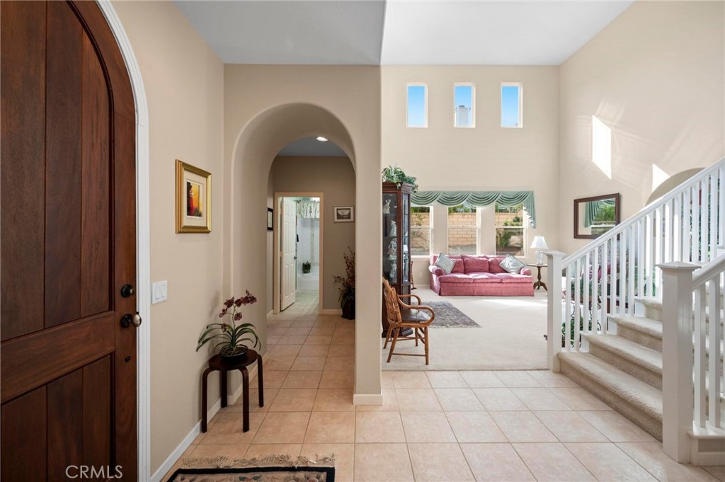 3262 Bluebird Circle Simi Valley, CA 93063 - Photo 4 of 43 a living room with furniture and a floor to ceiling window