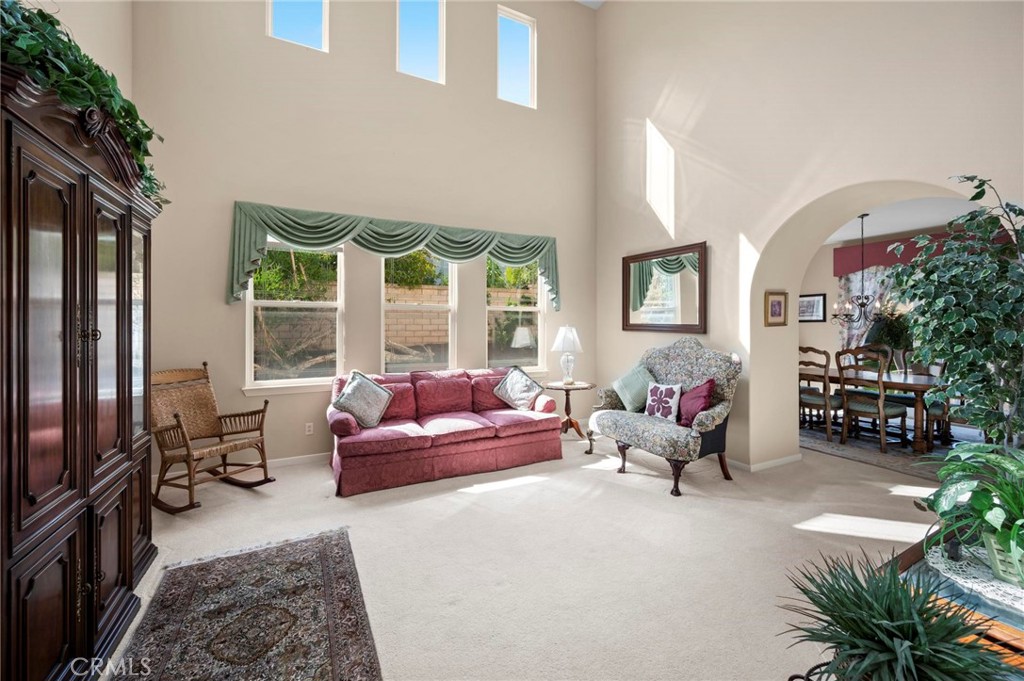 3262 Bluebird Circle Simi Valley, CA 93063 - Photo 7 of 43 a living room with furniture and a floor to ceiling window
