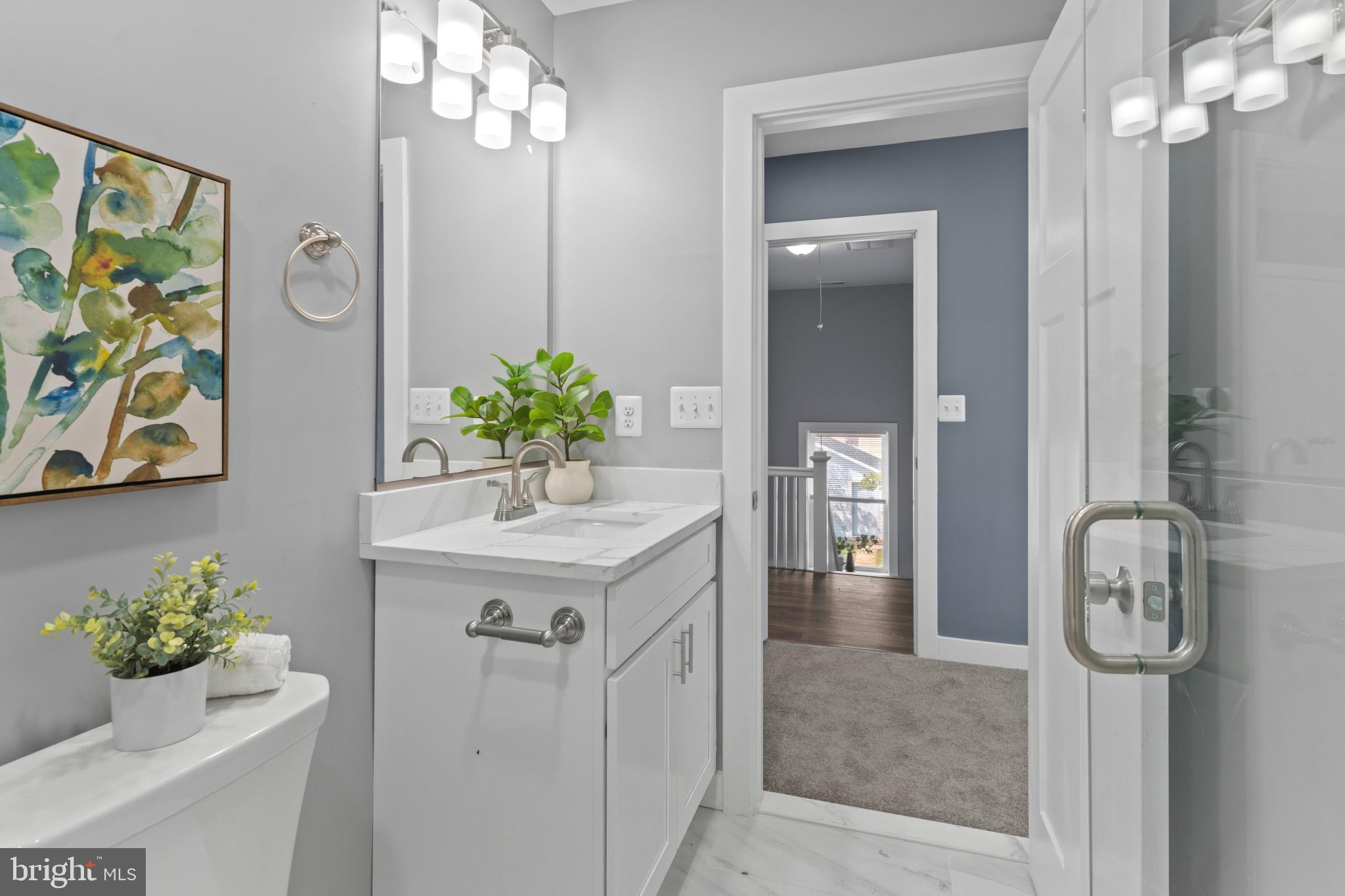5728 Clover Road Baltimore, MD 21215 - Photo 22 of 40 a bathroom with a sink vanity and mirror