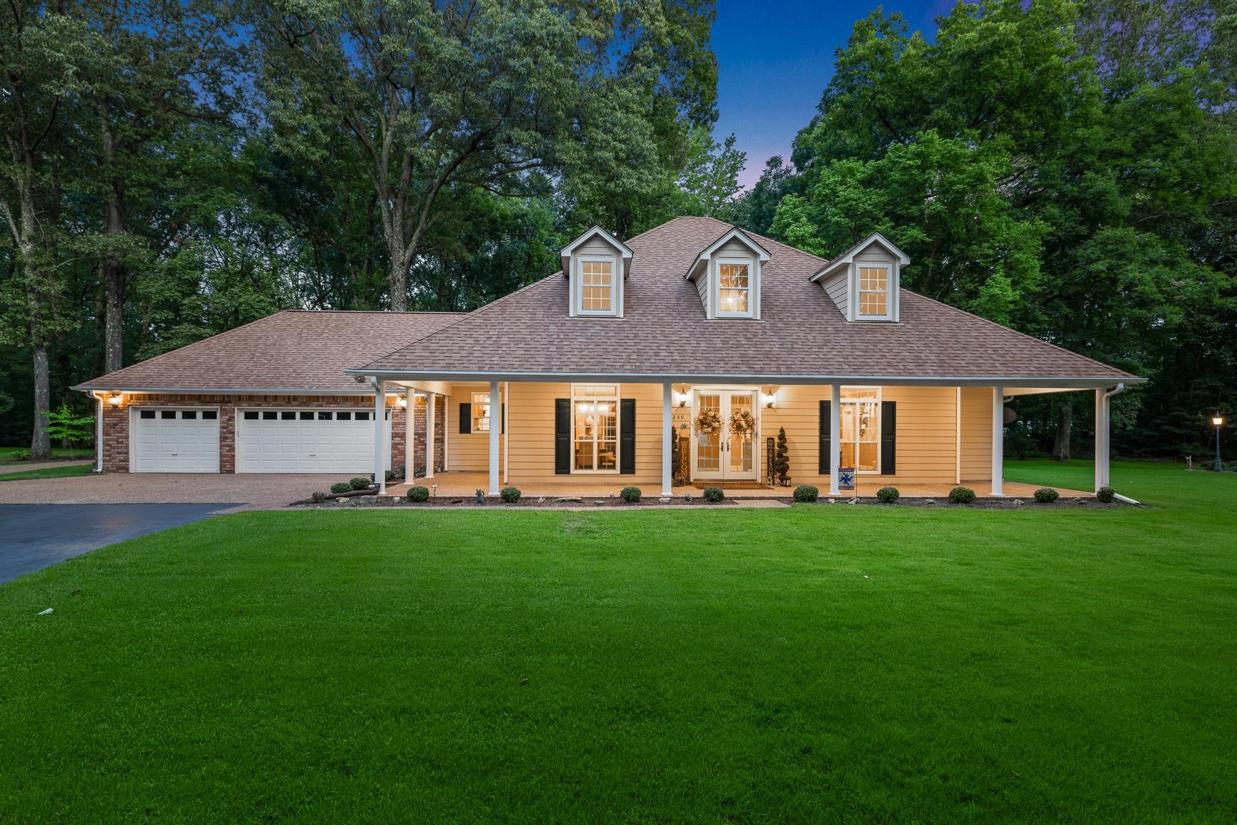 8240 Brunswick Road Millington, TN 38053 - Photo 1 of 25 a view of a house with a yard