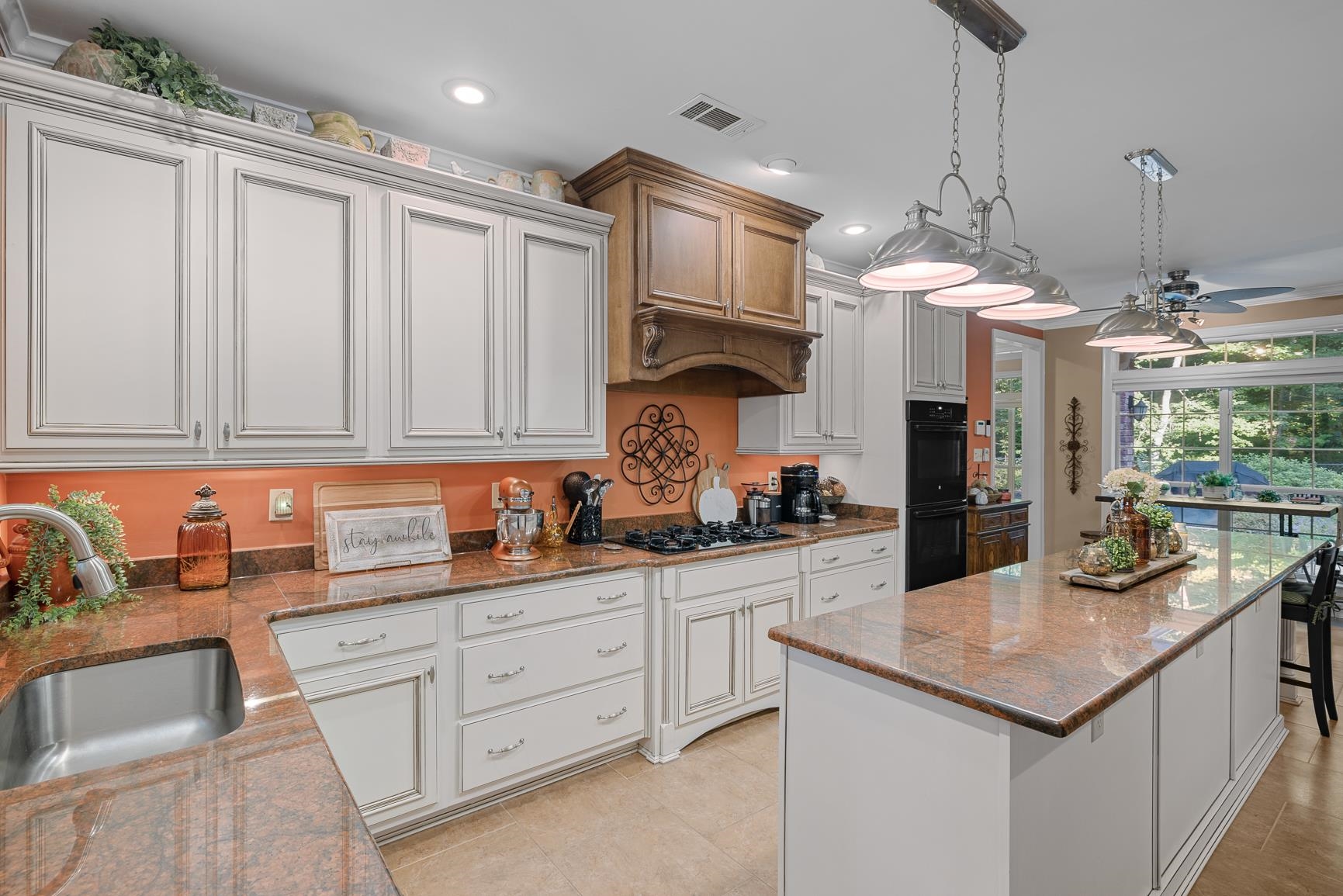 8240 Brunswick Road Millington, TN 38053 - Photo 14 of 25 a kitchen with white cabinets and sink