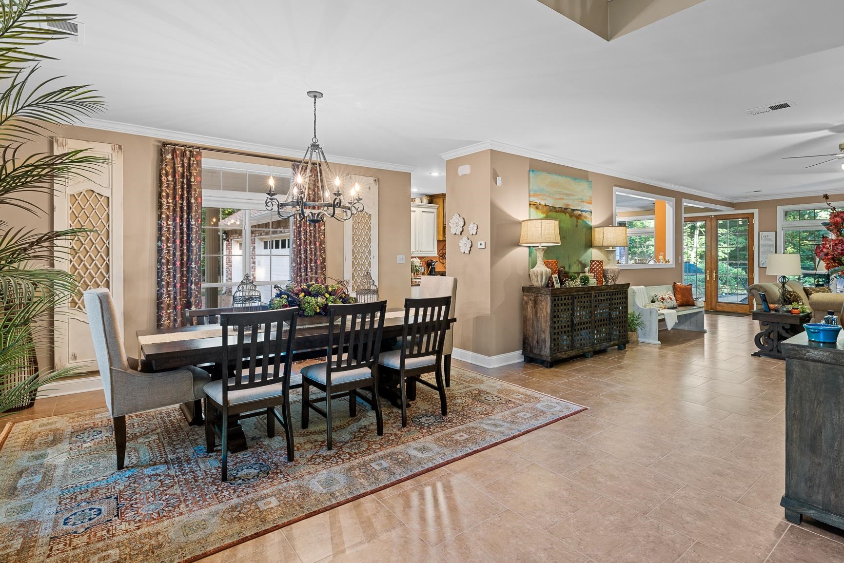 8240 Brunswick Road Millington, TN 38053 - Photo 8 of 25 a dining room with furniture a chandelier and wooden floor