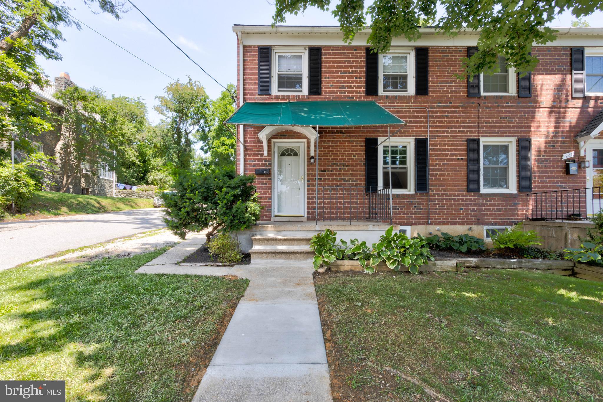 523 Academy Road Catonsville, MD 21228 - Photo 1 of 26 a front view of a house with garden