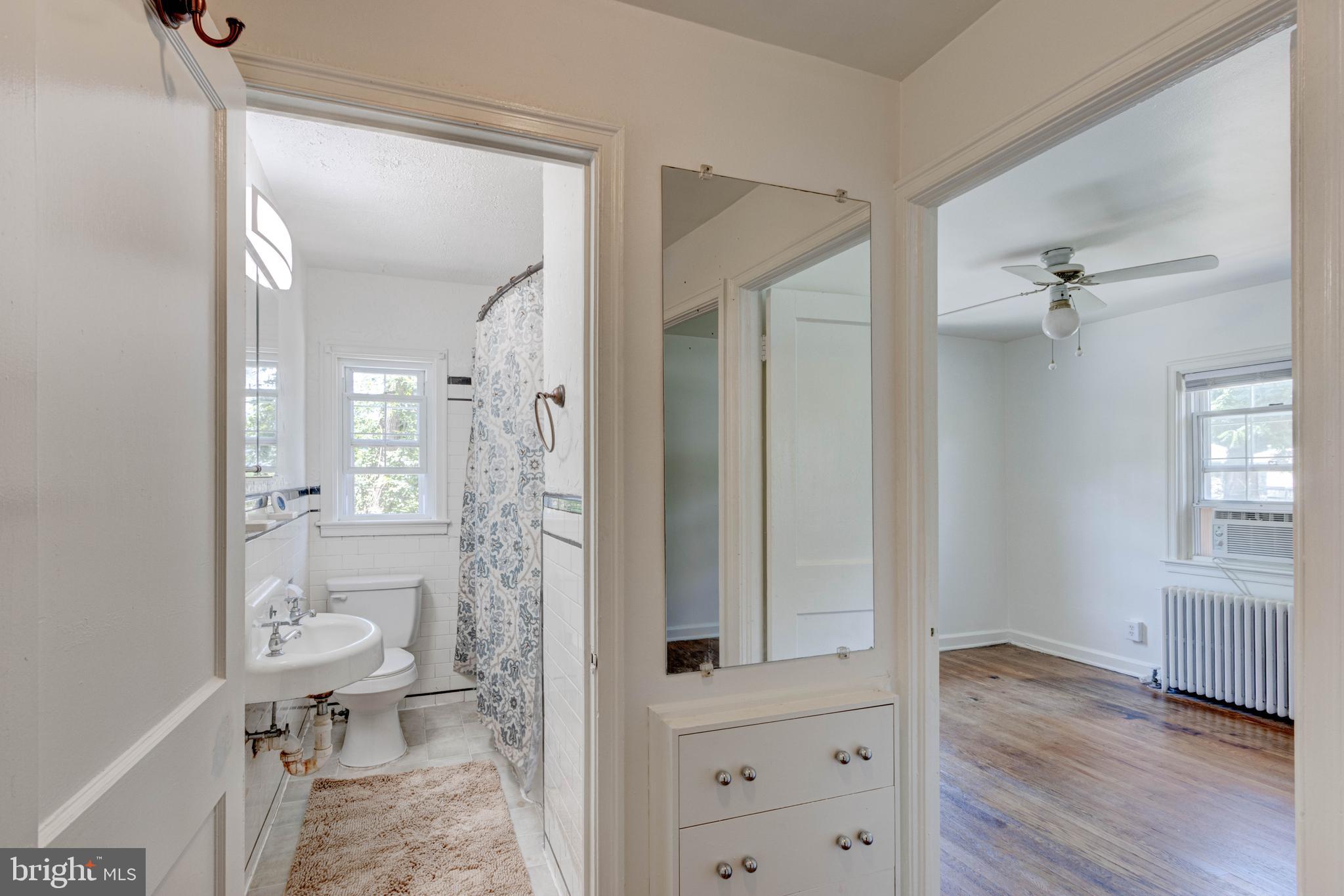 523 Academy Road Catonsville, MD 21228 - Photo 11 of 26 wooden floor view of bathroom and a bathroom