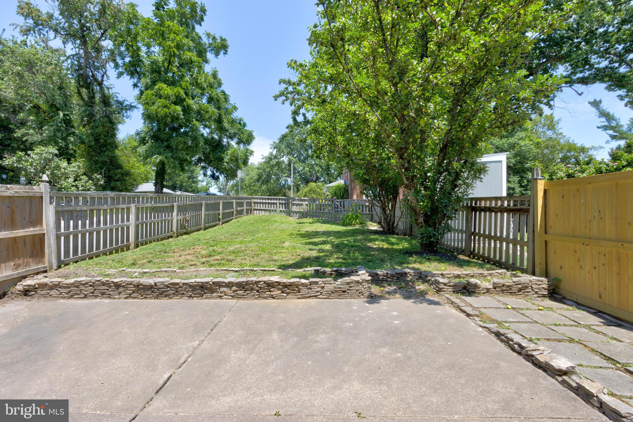 523 Academy Road Catonsville, MD 21228 - Photo 23 of 26 a view of a backyard with wooden fence