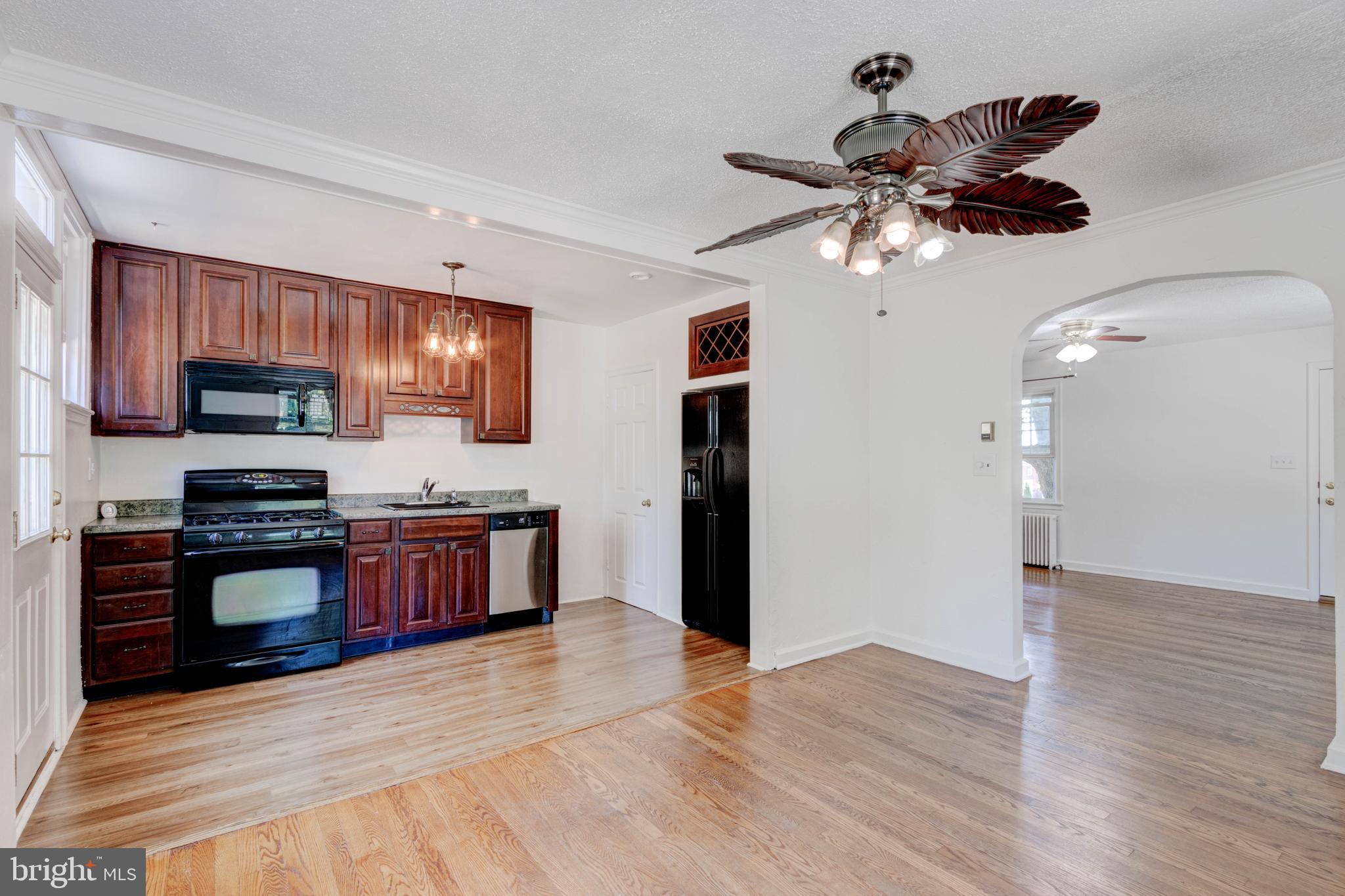 523 Academy Road Catonsville, MD 21228 - Photo 7 of 26 a view of a kitchen with stainless steel appliances granite countertop a refrigerator and microwave