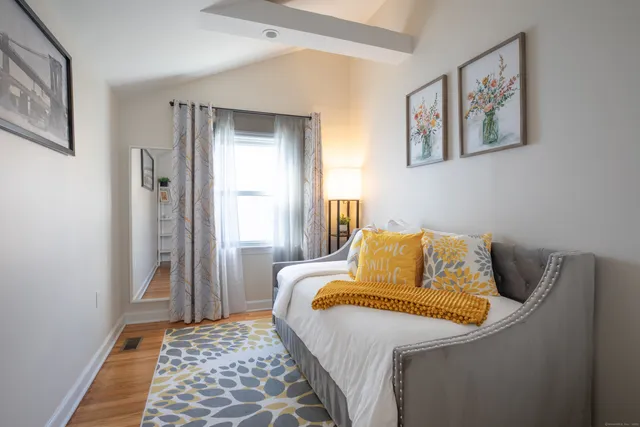 a bedroom with a bed and cupboard