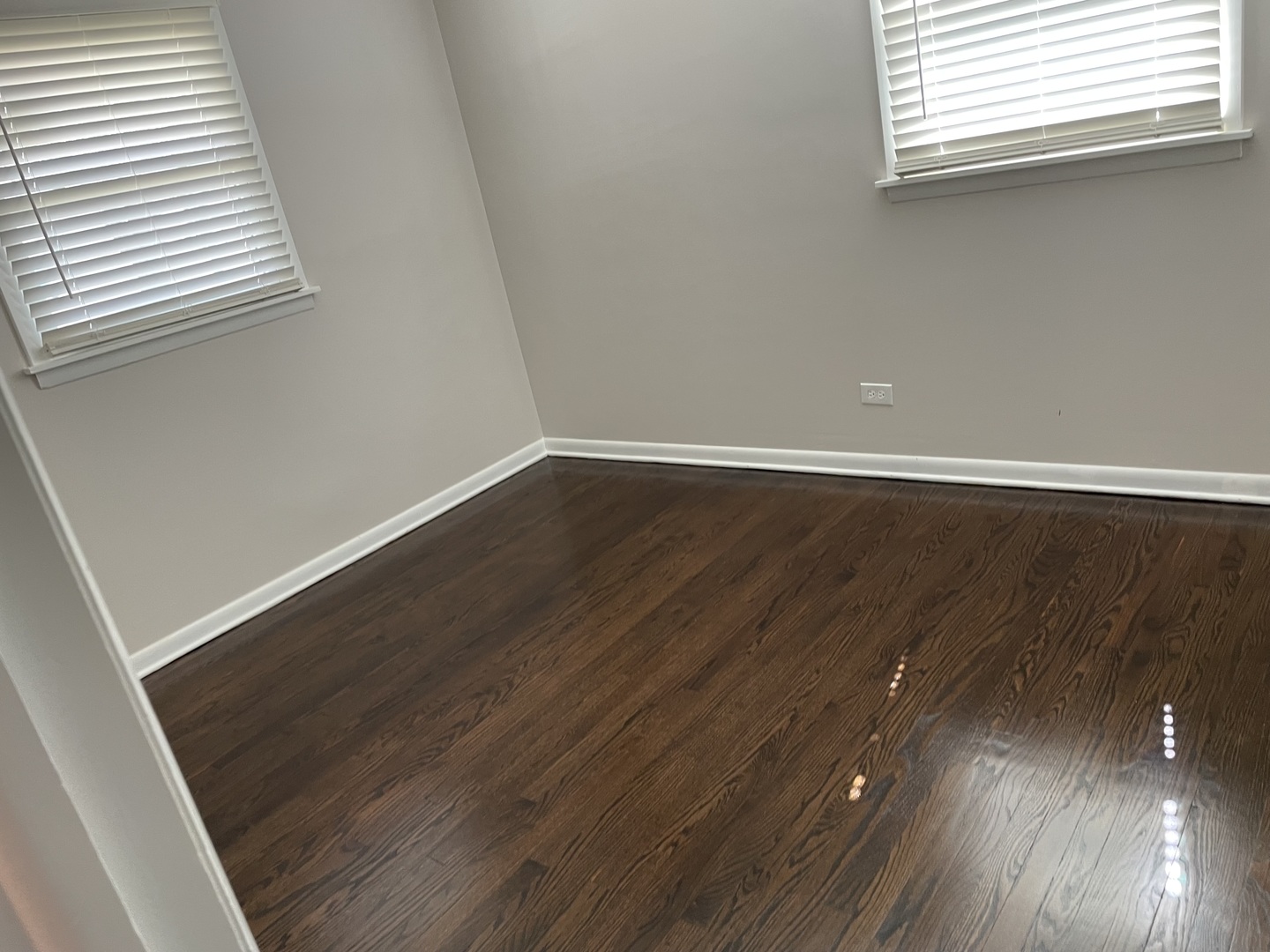 45 Arrowhead Drive Thornton, IL 60476 - Photo 4 of 8 an empty room with wooden floor and windows