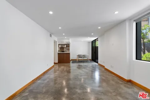 a bedroom with a large bed and a couch