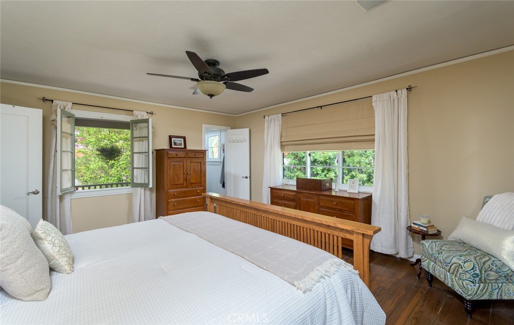 752 Glenview Road Glendale, CA 91202 - Photo 51 of 64 a bedroom with a bed and wooden floor