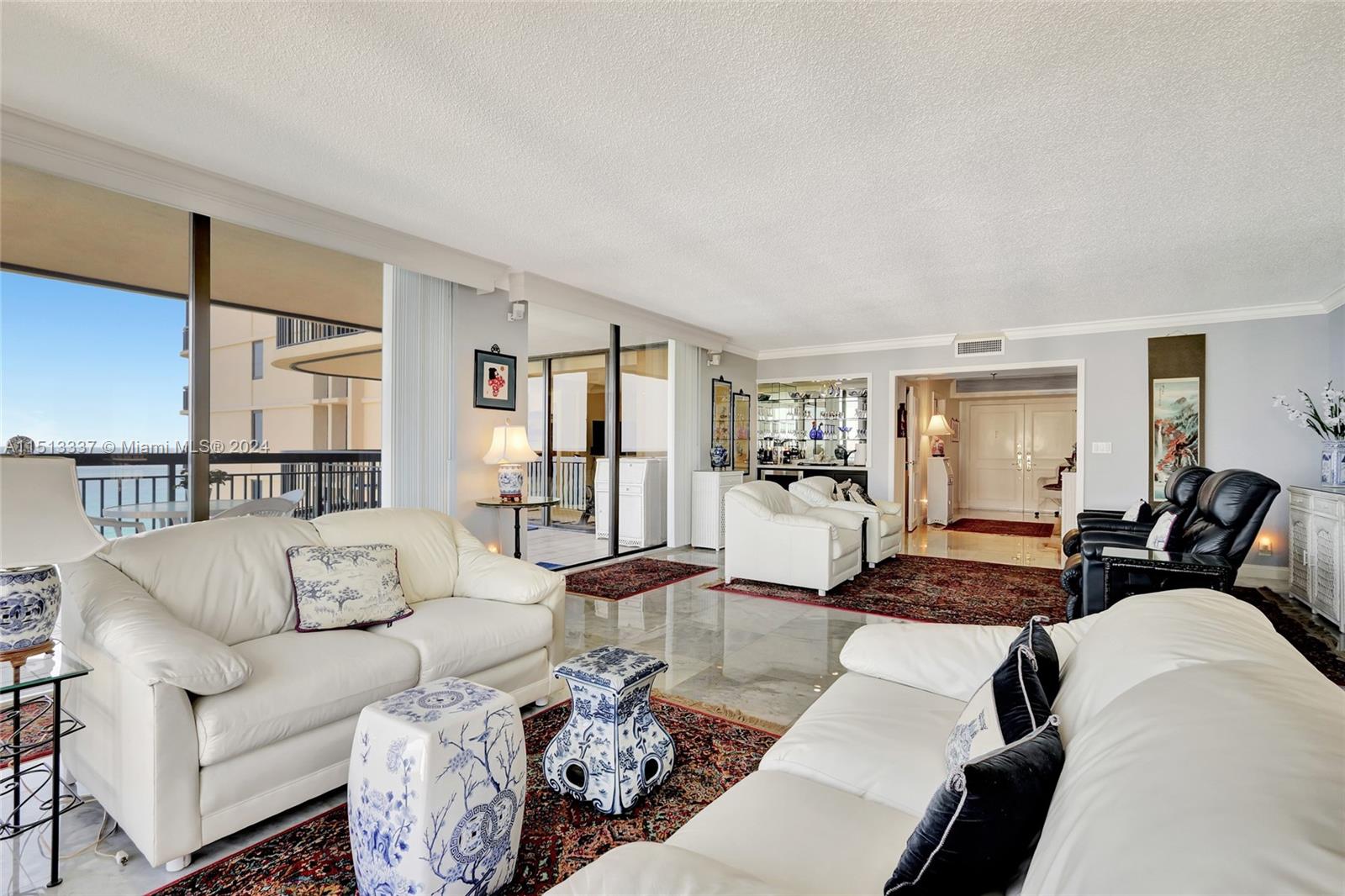 5380 North Ocean Drive, Unit 22J Riviera Beach, FL 33404 - Photo 12 of 83 a living room with furniture wooden floor and a table