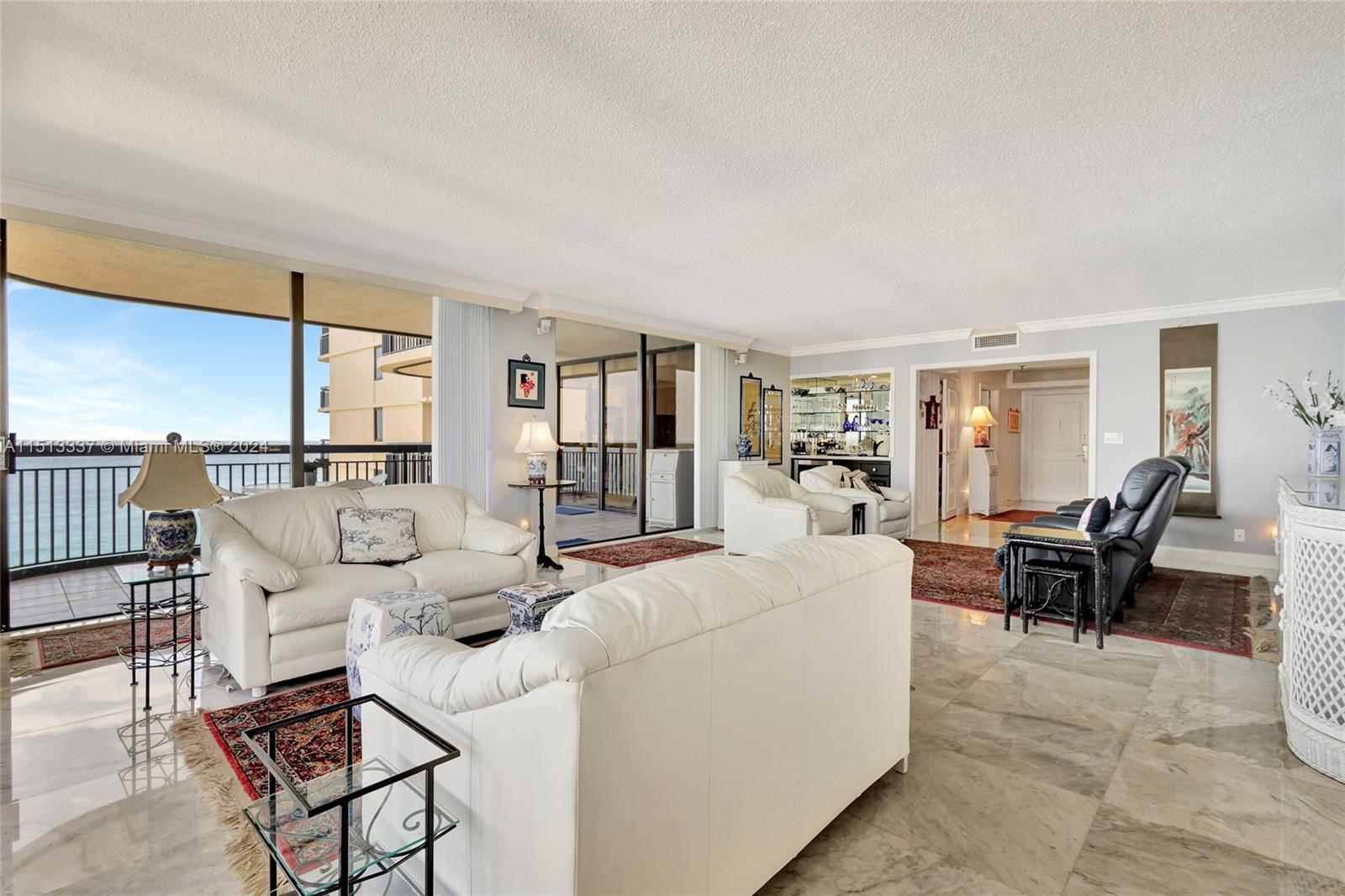 5380 North Ocean Drive, Unit 22J Riviera Beach, FL 33404 - Photo 13 of 83 a living room with furniture and a table