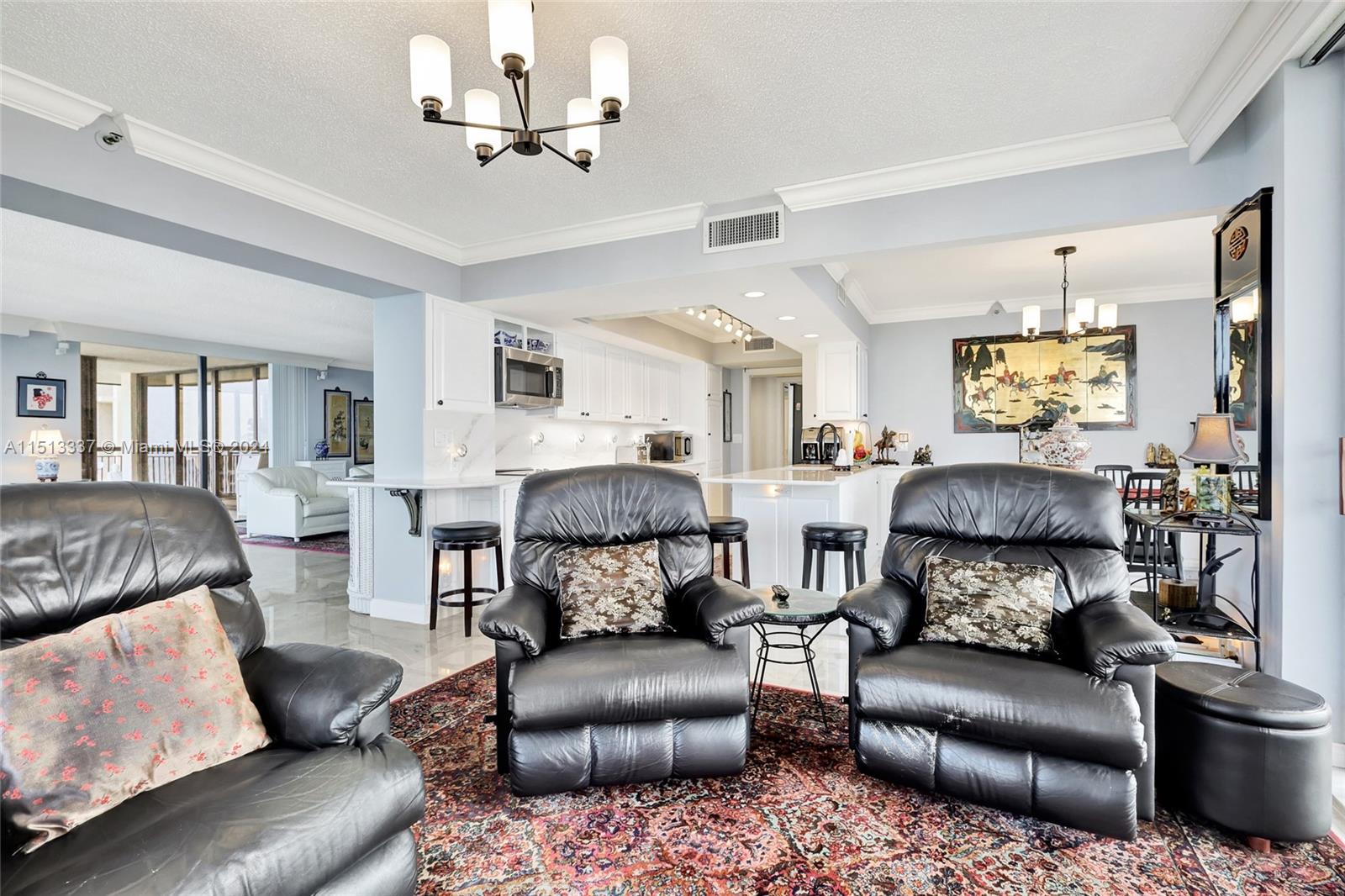 5380 North Ocean Drive, Unit 22J Riviera Beach, FL 33404 - Photo 20 of 83 a living room with furniture and a ceiling fan