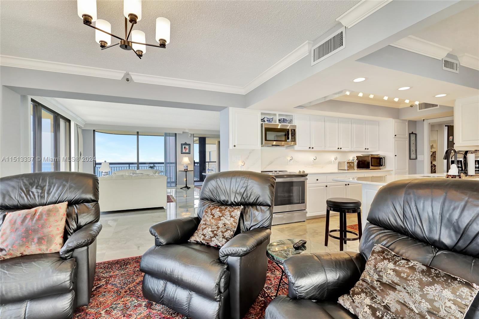 5380 North Ocean Drive, Unit 22J Riviera Beach, FL 33404 - Photo 22 of 83 a living room with furniture and a view of kitchen