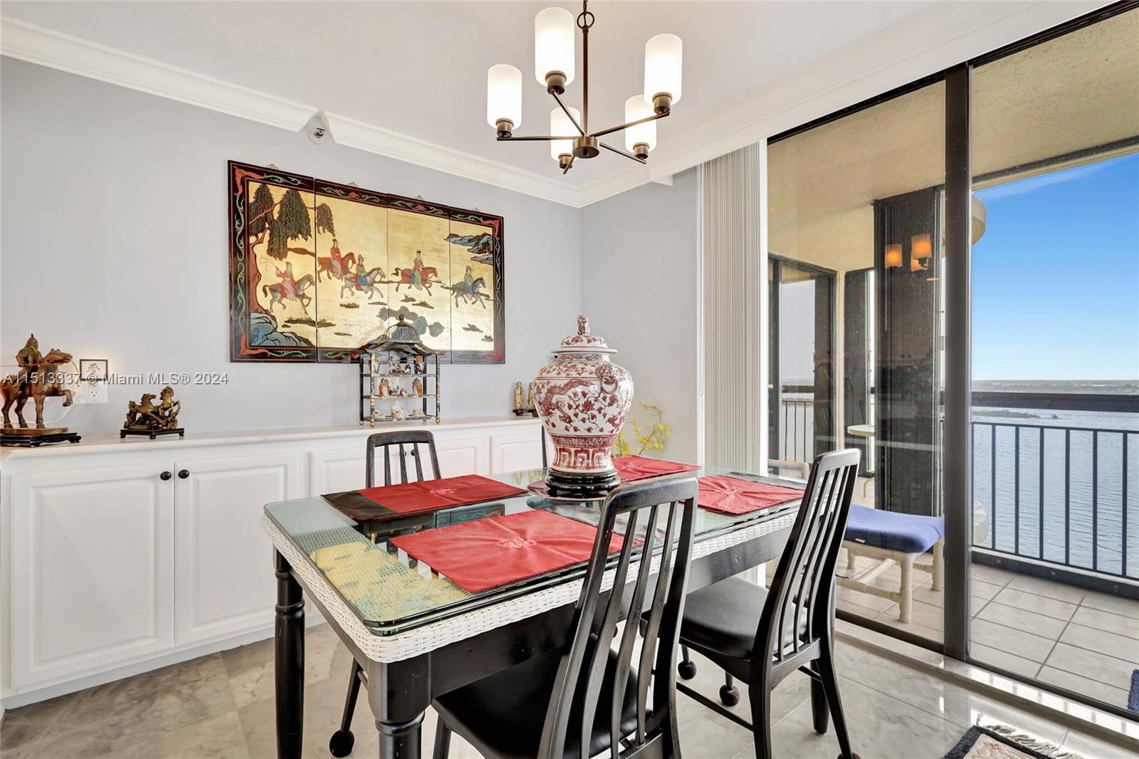 5380 North Ocean Drive, Unit 22J Riviera Beach, FL 33404 - Photo 25 of 83 a view of a dining room with furniture and chandelier