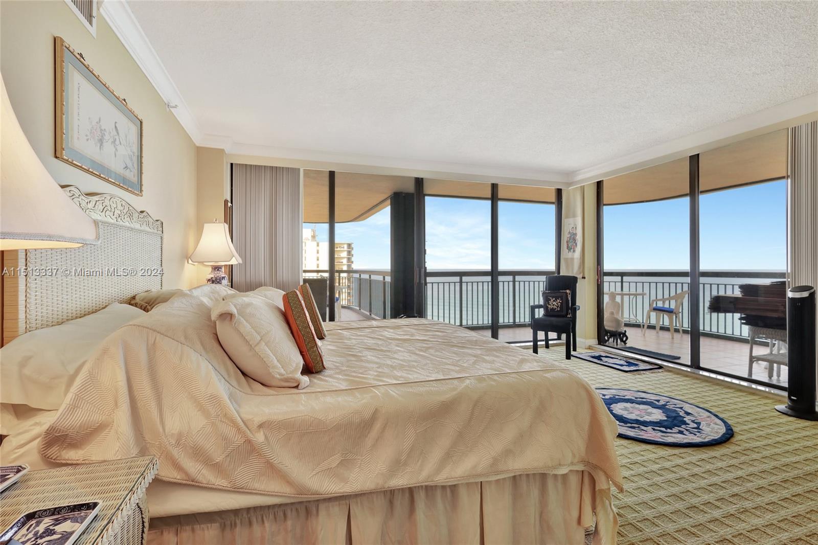 5380 North Ocean Drive, Unit 22J Riviera Beach, FL 33404 - Photo 35 of 83 a bedroom with a bed and a large window with outer view