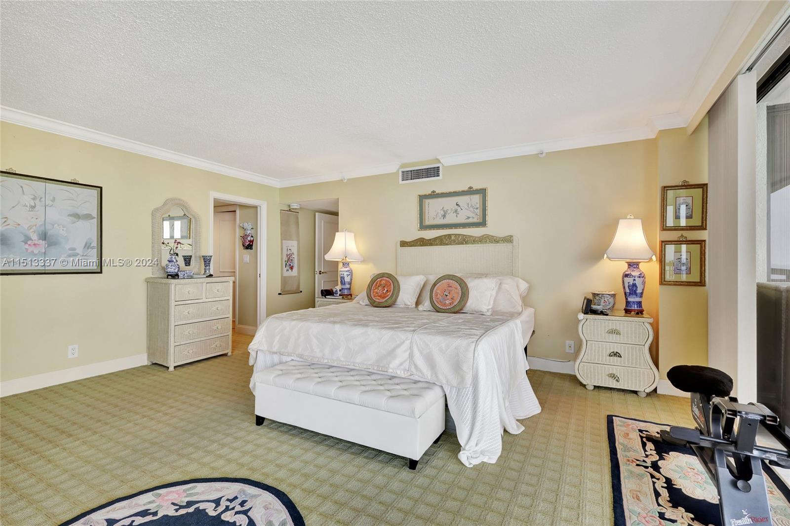 5380 North Ocean Drive, Unit 22J Riviera Beach, FL 33404 - Photo 37 of 83 a bedroom with a bed and wooden floor