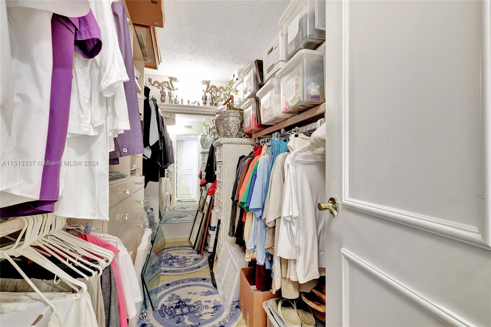 5380 North Ocean Drive, Unit 22J Riviera Beach, FL 33404 - Photo 44 of 83 a view of walk in closet with clothes and shoes