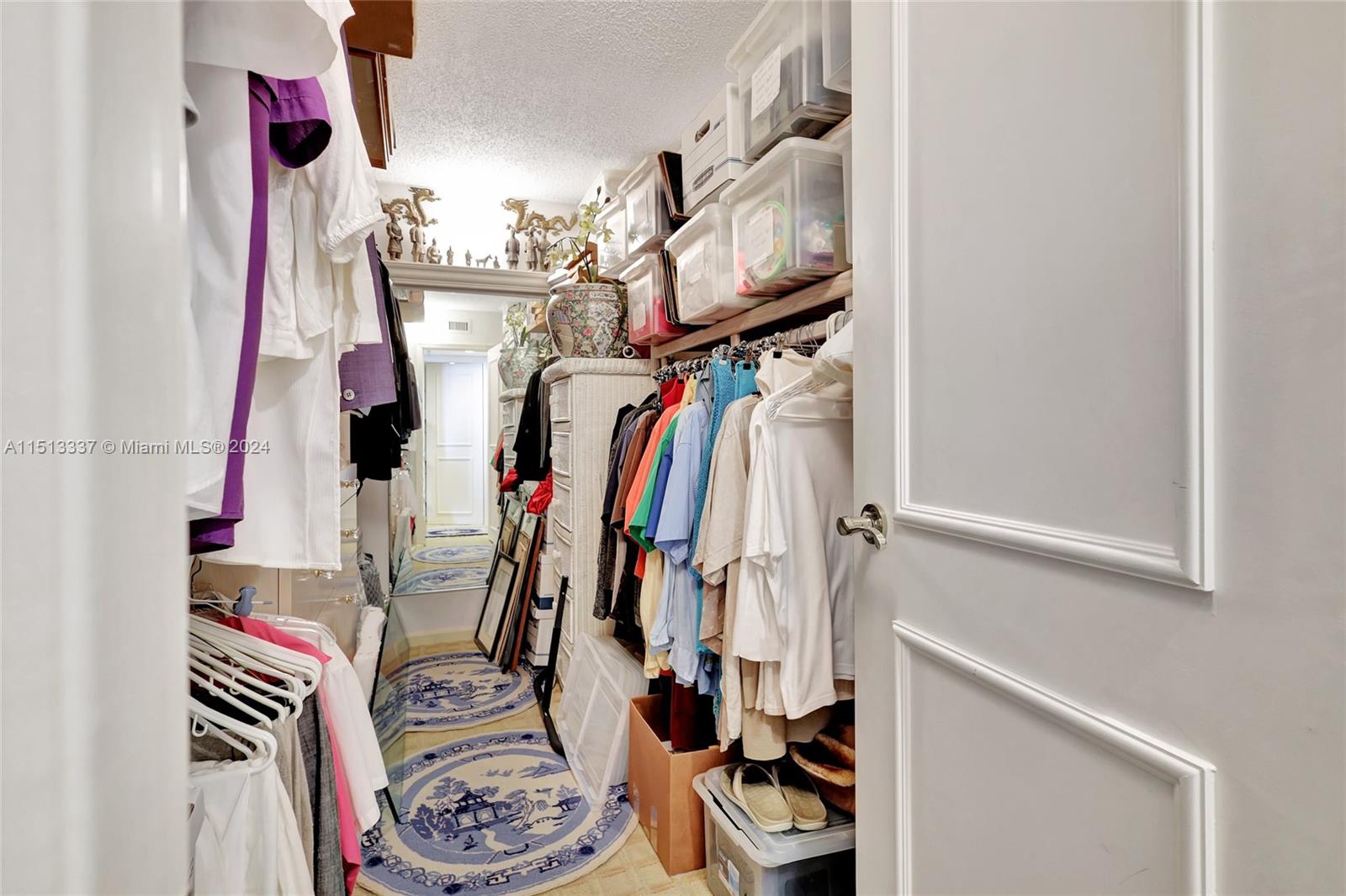 5380 North Ocean Drive, Unit 22J Riviera Beach, FL 33404 - Photo 45 of 83 a view of walk in closet with clothes and shoes