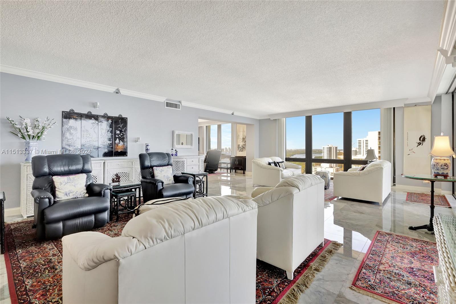 5380 North Ocean Drive, Unit 22J Riviera Beach, FL 33404 - Photo 5 of 83 a living room with furniture and a rug