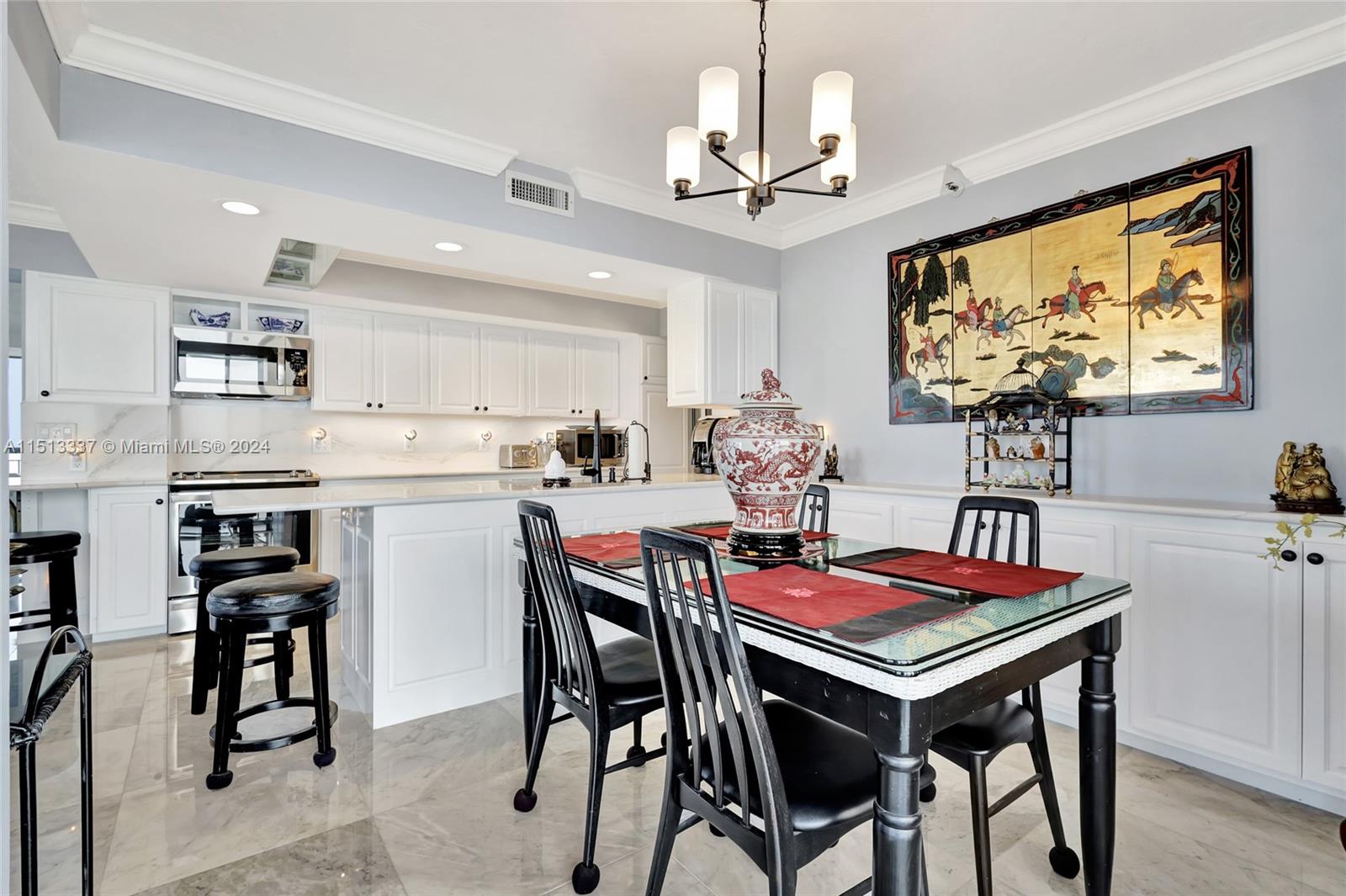 5380 North Ocean Drive, Unit 22J Riviera Beach, FL 33404 - Photo 6 of 83 a view of a dining room with furniture kitchen and wooden floor