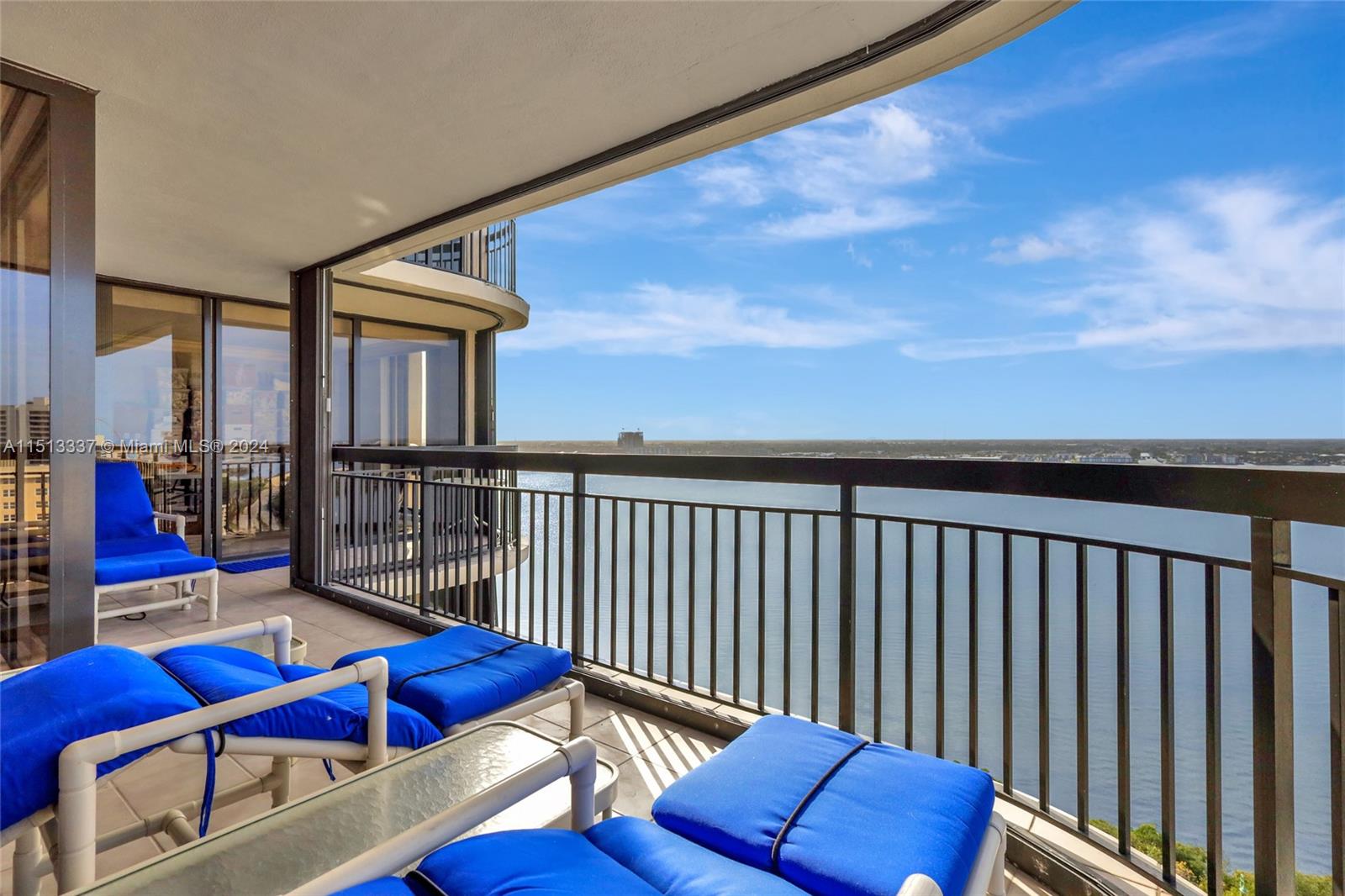 5380 North Ocean Drive, Unit 22J Riviera Beach, FL 33404 - Photo 65 of 83 a balcony with furniture and wooden floor