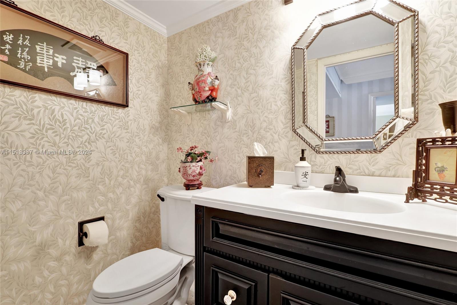 5380 North Ocean Drive, Unit 22J Riviera Beach, FL 33404 - Photo 67 of 83 a bathroom with a sink and a mirror