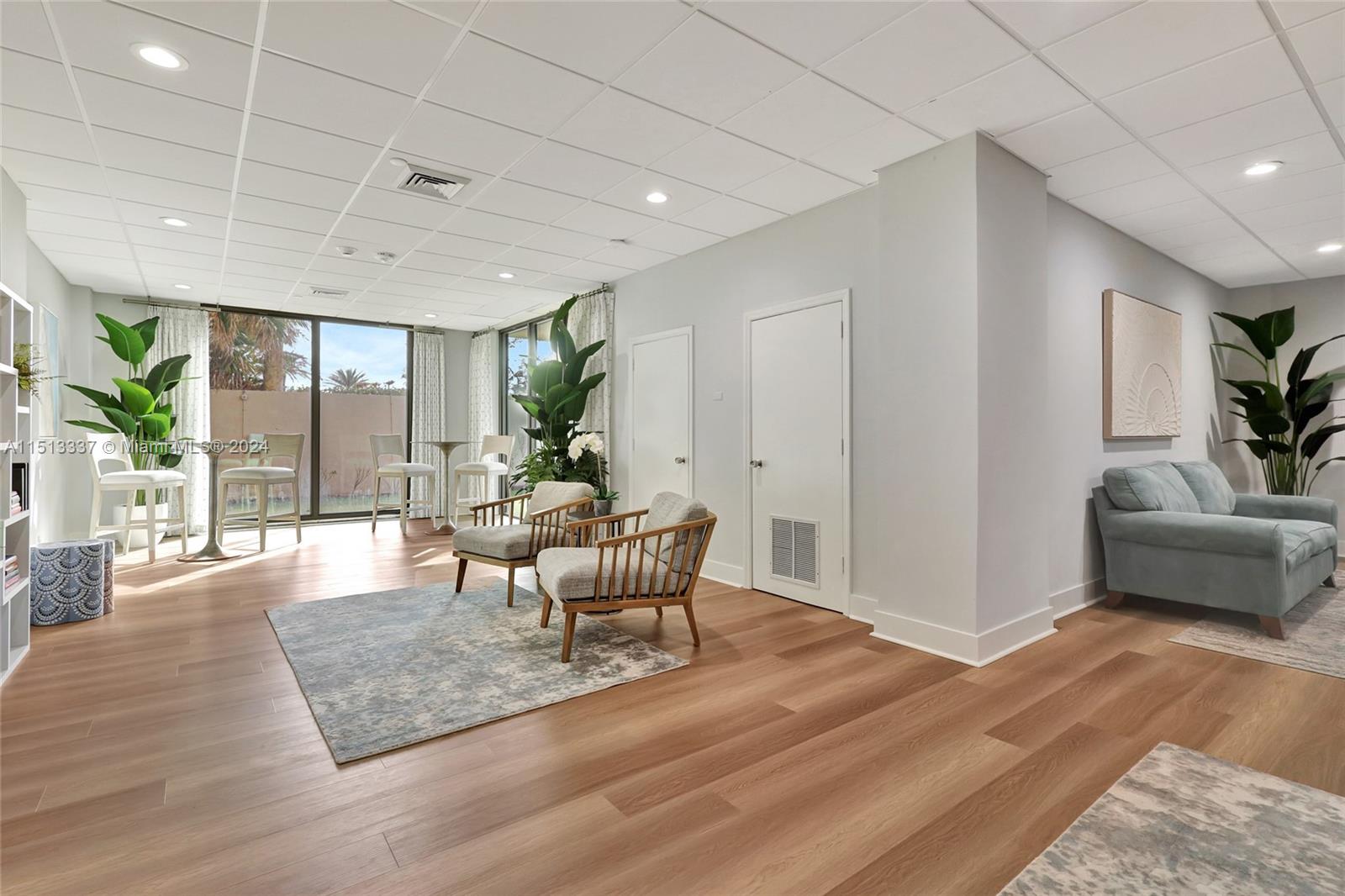 5380 North Ocean Drive, Unit 22J Riviera Beach, FL 33404 - Photo 76 of 83 a living room with furniture wooden floor and a rug