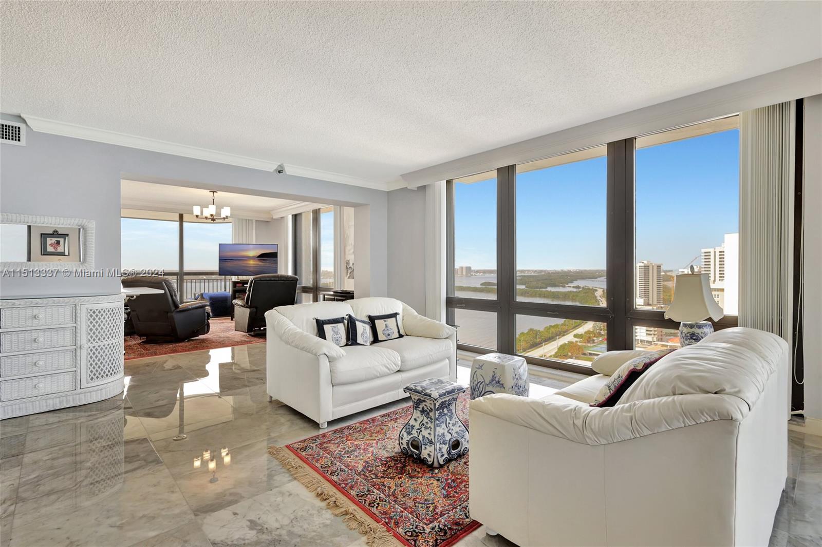5380 North Ocean Drive, Unit 22J Riviera Beach, FL 33404 - Photo 10 of 83 a living room with furniture and large windows