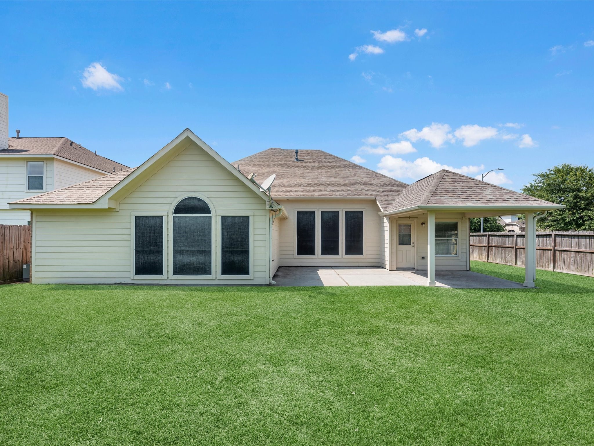 5122 Dripping Spring Avenue Baytown, TX 77523 - Photo 4 of 33 Over-sized backyard w/ extended, covered patio