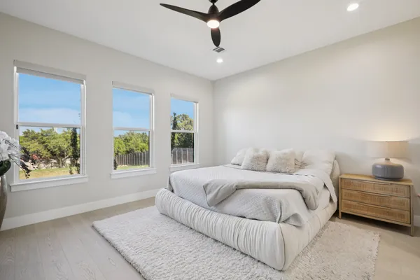 a living room with furniture windows and wooden floor
