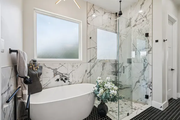 a bathroom with a sink a mirror and a painting on the wall