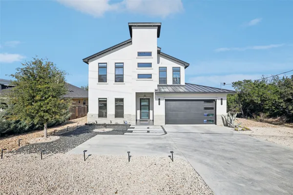 a front view of a house with yard