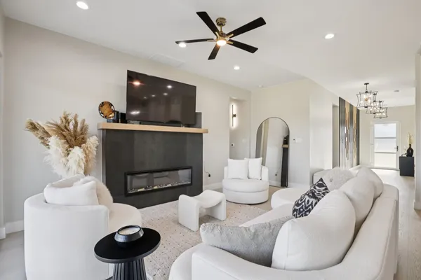 a living room with furniture and a fireplace