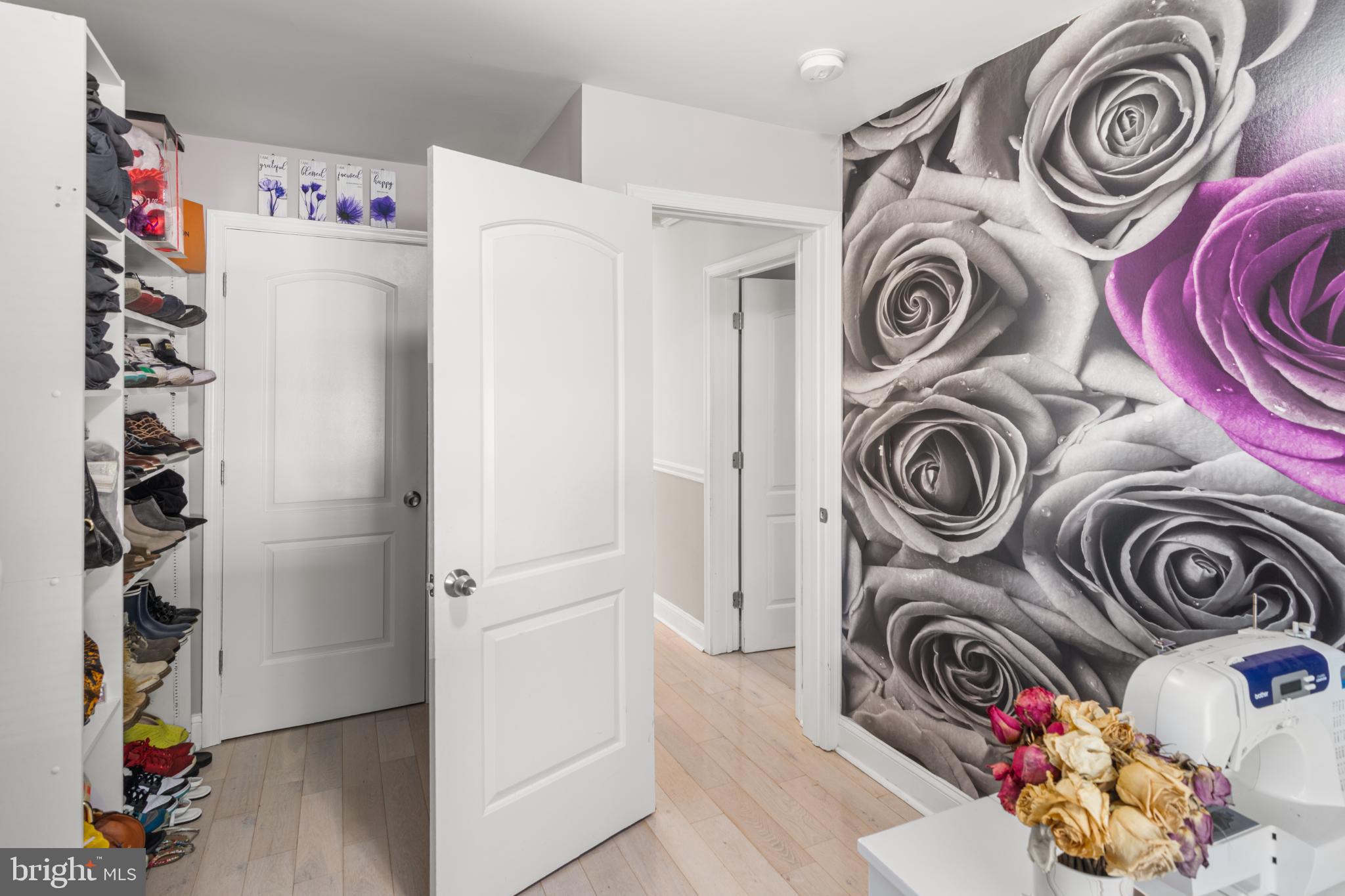 5219 West North Avenue Baltimore, MD 21207 - Photo 12 of 34 Chic entryway with floral accent wall.