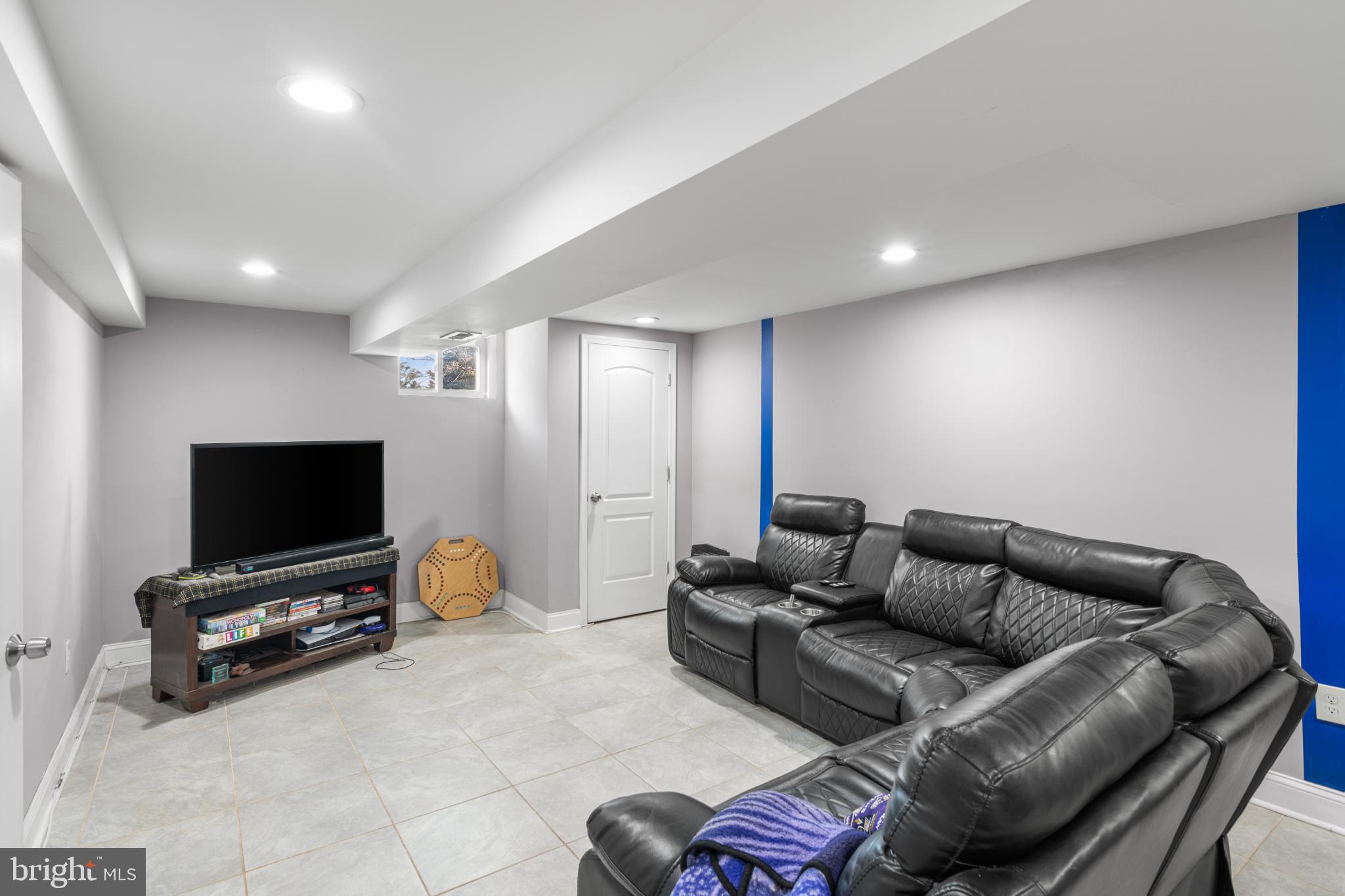 5219 West North Avenue Baltimore, MD 21207 - Photo 16 of 34 Modern basement retreat with sleek design.