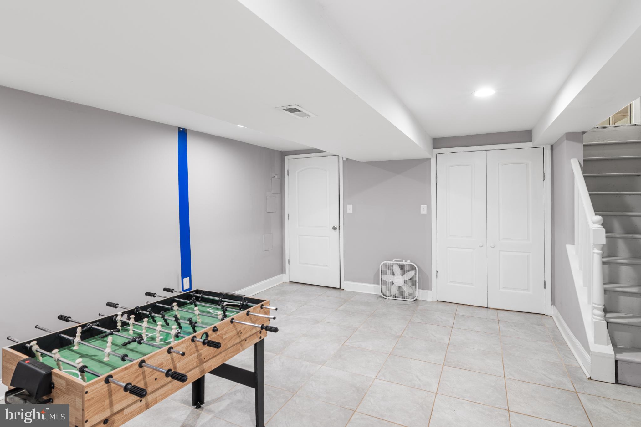 5219 West North Avenue Baltimore, MD 21207 - Photo 19 of 34 Spacious basement with game area.